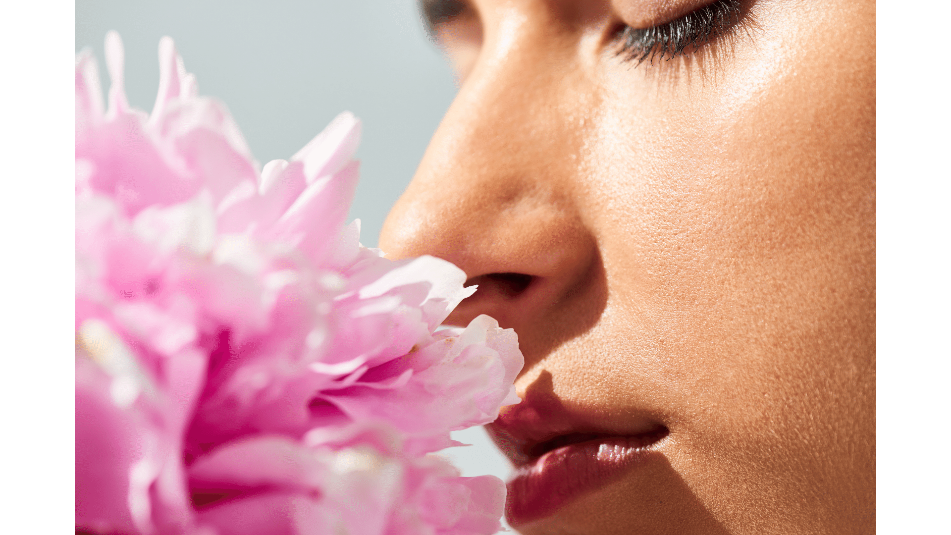 Woman Smelling Flower - Exploring Aromatherapy Candle Benefits